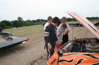 Fellow racers inspect the crash